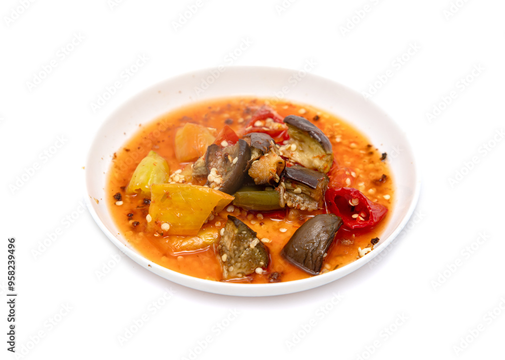 A bowl of food with vegetables and a sauce A bowl of food with vegetables and a sauce