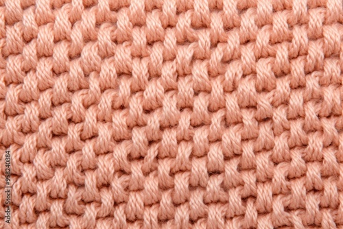 Peach close-up of monochrome carpet texture background from above. Texture tight weave carpet blank empty pattern with copy space for product 