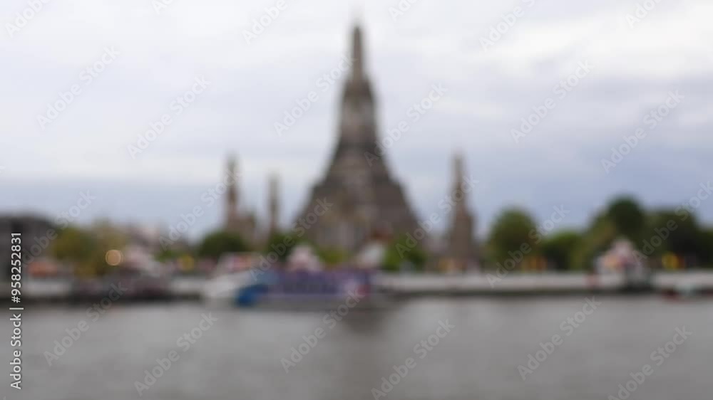 Bokeh view of blurred Buddhist temple Wat Arun on the banks of the Chao Phraya river, Bangkok, Thailand. Bokeh view of blurred Buddhist temple Wat Arun on the banks of the Chao Phraya river, Bangkok, Thailand.