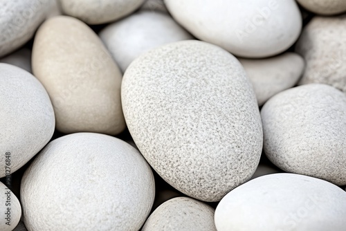 Close-up of smooth white pebbles with interesting textures