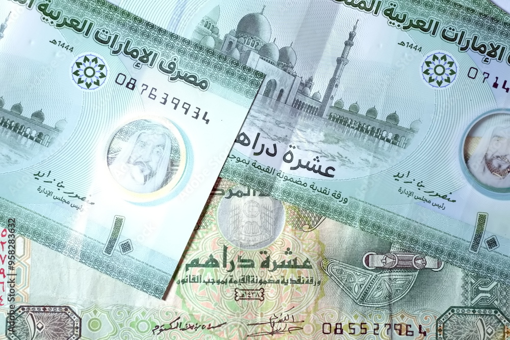 Fototapeta premium Close up Dirhams currency with new design Notes, AED, Bank notes and coins, United Arab Emirates