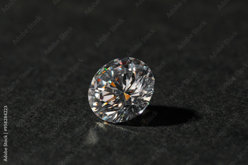 Beautiful shiny diamond on black table, closeup Beautiful shiny diamond on black table, closeup