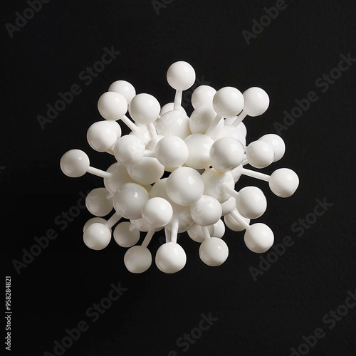 a ball and stick model of one zwitterionic form of creatine, made of white clay. Floating against a completely black background. photo