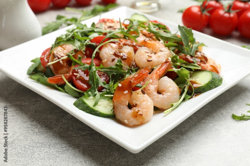 Delicious shrimp salad with vegetables on grey textured table, closeup Delicious shrimp salad with vegetables on grey textured table, closeup