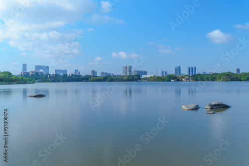 City park lake scenery with blue sky and white clouds