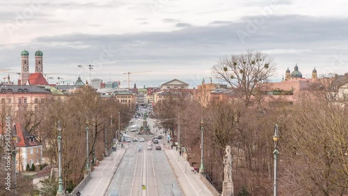 Panoramic aerial view from Maximilianeum timelapse with driving cars and tramway on Maximilian Bridge and Maximilianstrasse, Munich, Germany. Famous landmarks in a distance photo