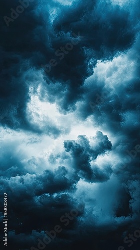 Dramatic clouds swirl in an ethereal sky, capturing the essence of nature's beauty and moodiness before a storm.