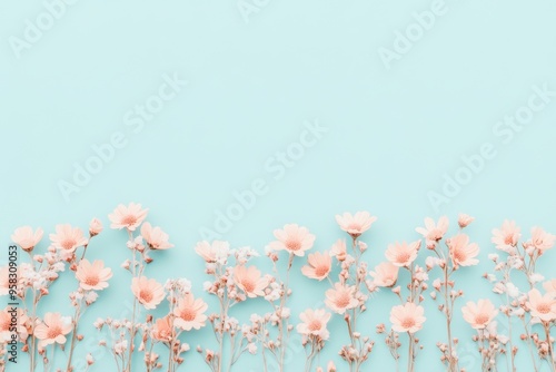 Pastel springtime floral pattern on soothing blue background