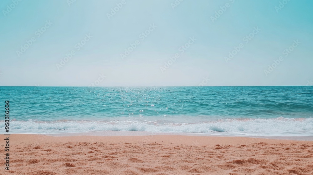 Obraz premium Serene beachscape with clear blue sky gentle waves
