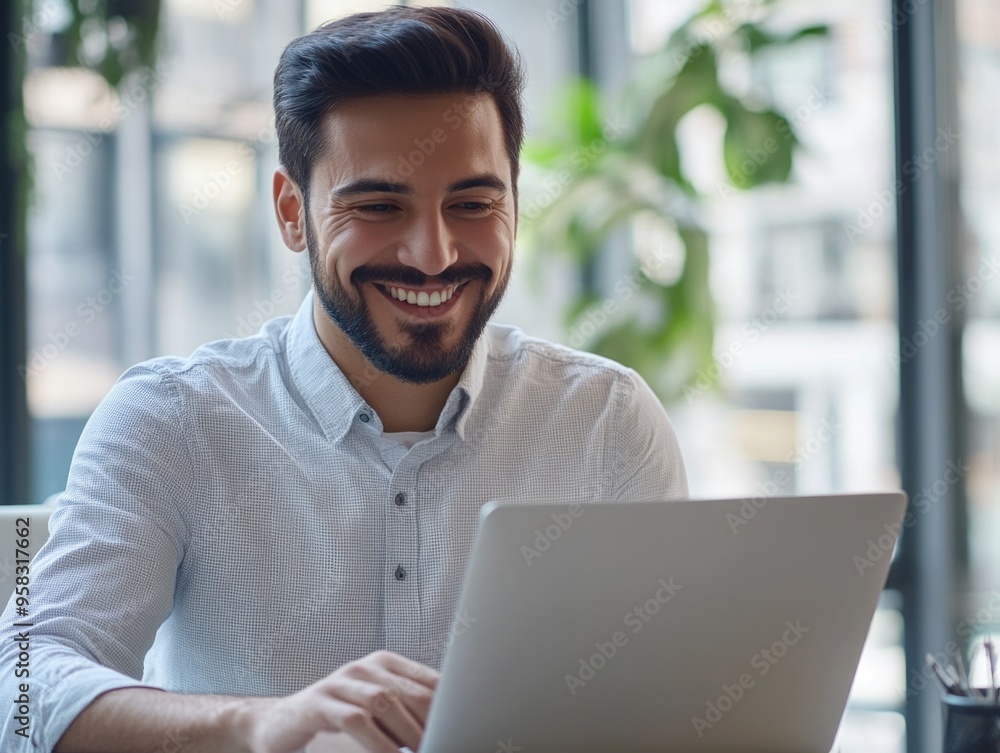 Smiling Businessman Using Laptop Smiling Businessman Using Laptop