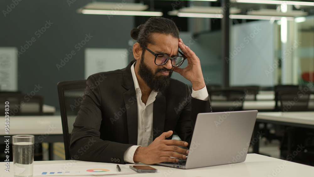 Stressed ill sick Indian male employer company corporate Arabian entrepreneur boss CEO business man Muslim businessman at office with laptop working feel headache migraine pain ache problem think Stressed ill sick Indian male employer company corporate Arabian entrepreneur boss CEO business man Muslim businessman at office with laptop working feel headache migraine pain ache problem think