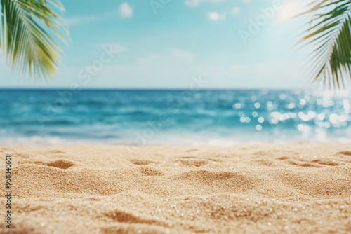 Beautiful sandy beach and soft blue ocean waves and palm trees.