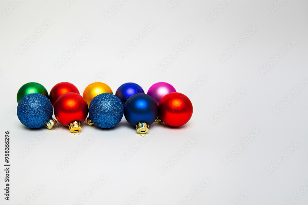 Colourful red Christmas balls on a white background. Red, yellow, green, blue, dark blue, orange, grey, purple, purple, pink Colourful red Christmas balls on a white background. Red, yellow, green, blue, dark blue, orange, grey, purple, purple, pink