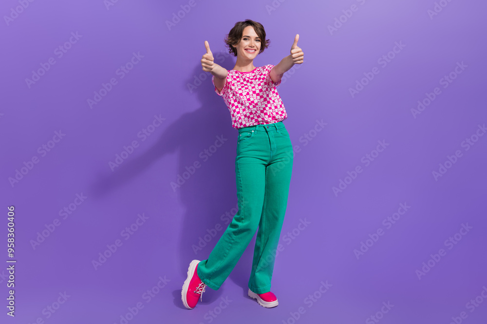 Full length photo of lovely young lady show thumb up good quality dressed stylish pink garment isolated on violet color background Full length photo of lovely young lady show thumb up good quality dressed stylish pink garment isolated on violet color background