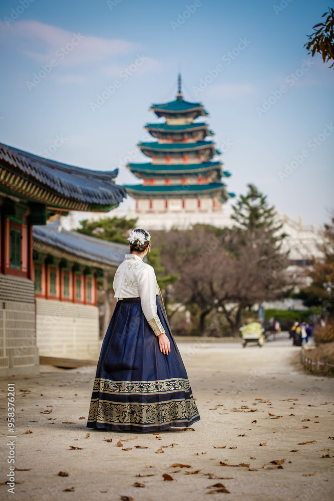 Tourists in national clothes walk in Gyeongbokgung Palace. Hanbok dress. South Korea