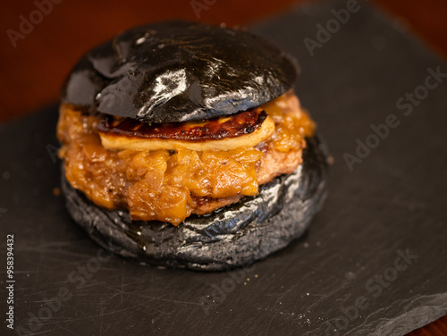 Cheese burger with bacon and egg on black background	
 photo