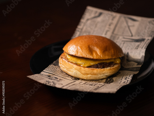 Cheese burger with bacon and egg on black background	
 photo