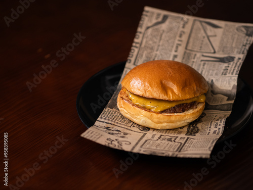 Cheese burger with bacon and egg on black background	
 photo