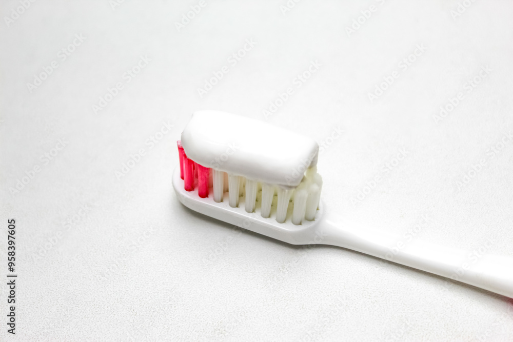 toothbrush with toothpaste on white toothbrush with toothpaste on white