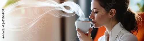 A serene moment captured as a woman enjoys a warm beverage, surrounded by soft light and gentle steam rising from her cup. photo