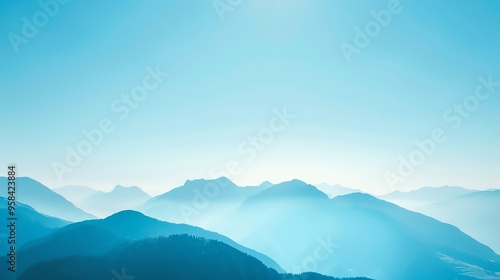 A vast, blue mountain range against a bright blue sky.