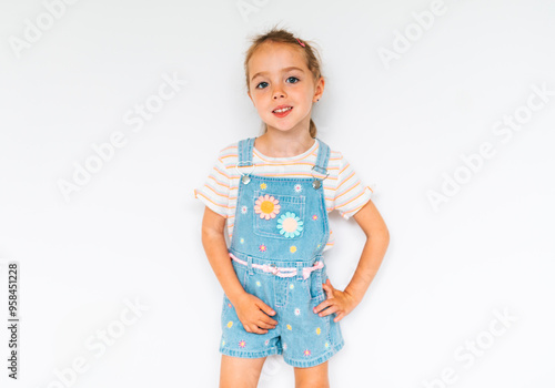 Cute girl 4-5 year old posing in studio