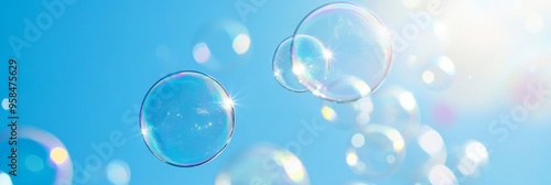 Wallpaper Mural Transparent soap bubbles float gracefully in a clear blue sky with fluffy white clouds Torontodigital.ca