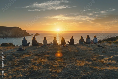 Group Enjoying Sunset Near Ocean on Rocky Cliff