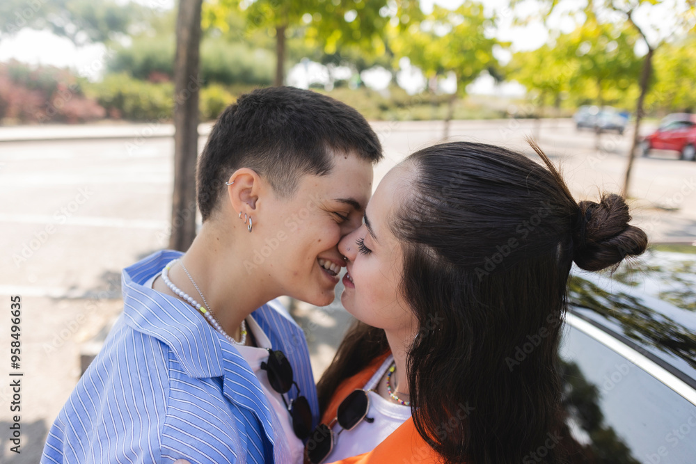 Lesbian couple enjoying a romantic moment in a city park Lesbian couple enjoying a romantic moment in a city park