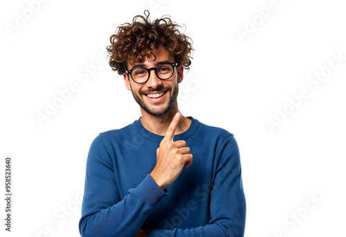 A young man with glasses, smiling and pointing at the upper right corner showing something, isolated on a white background