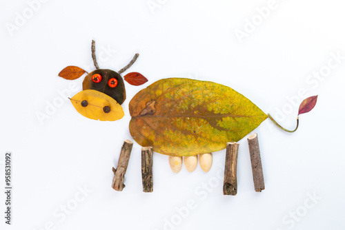 autumn nature craft for kids, cow made of leaf, top view, activity for children, photo