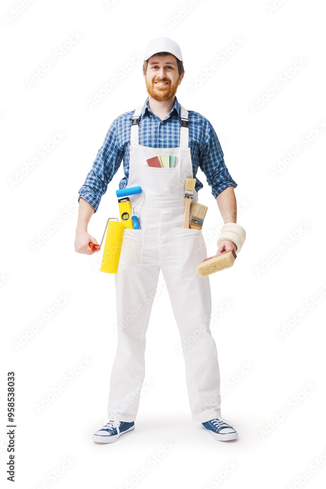 Confident house painter posing with work tools Confident house painter posing with work tools