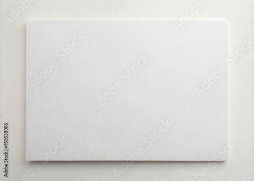 A crisp, blank, and high-quality white cardstock with a subtle texture, providing a clean and neutral background for