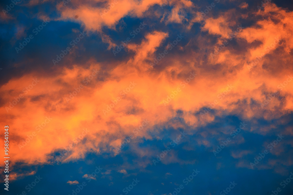 Orange glowing evening clouds in the sky above the Brunnenbach in the forest near Augsburg Siebenbrunn Orange glowing evening clouds in the sky above the Brunnenbach in the forest near Augsburg Siebenbrunn