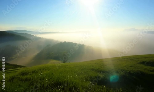 Sunrise Over Foggy Mountains