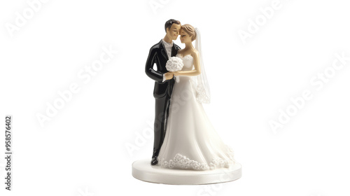 A bride and groom wedding cake topper figurine. The couple is embracing, with the bride holding a bouquet, symbolizing love and commitment on their special day. 