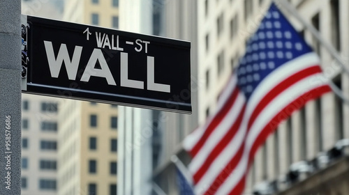 Iconic Wall Street Sign Against Waving American Flag with Blurred Cityscape Background
