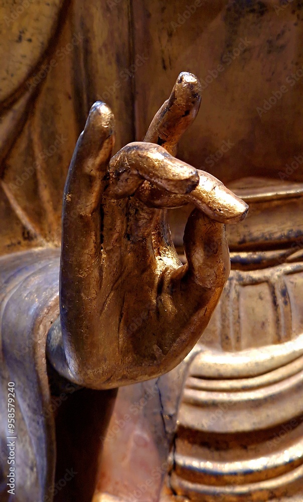Detail of a Buddha statue doing mudra Detail of a Buddha statue doing mudra