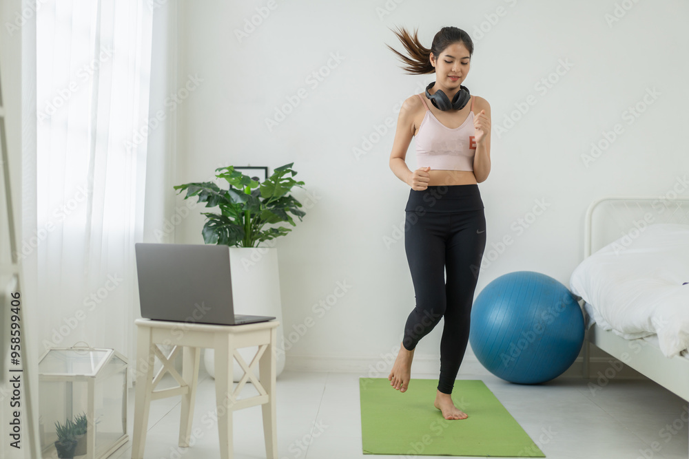 Fototapeta premium Portrait of sport slim fit strength asian woman training in sportswear relax and practicing yoga, fitness, exercise, wellness, workout, sport at home.Diet concept.Fitness and healthy lifestyle