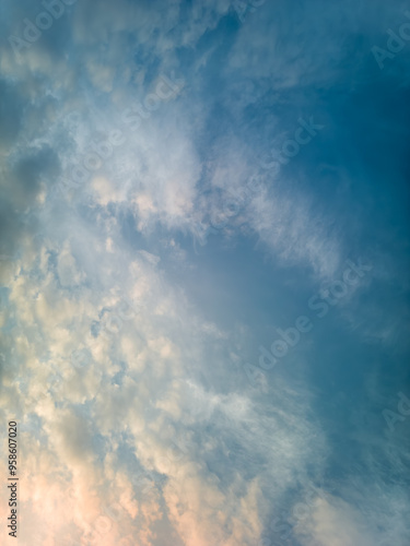 The rays of the sun breaking through the dramatic clouds in the evening or in the morning in the sunset or sunrise sky.