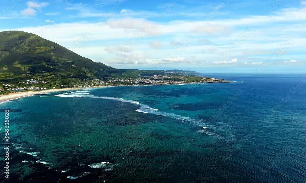 Aerial View of Coastal Town with Lush Mountain Aerial View of Coastal Town with Lush Mountain