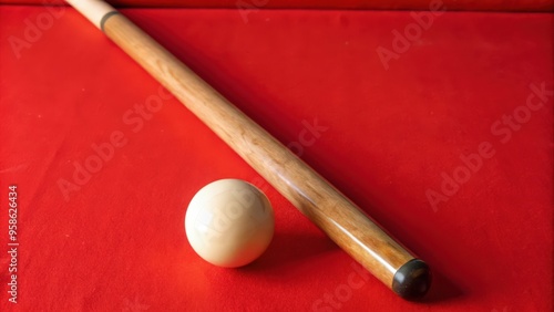 Cue Stick and White Billiard Ball on a Red Felt Surface photo