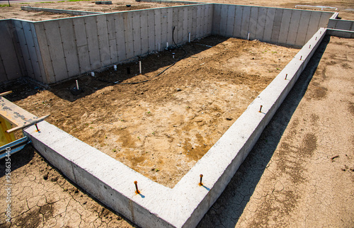 Concrete footings and basement in place, ready for next phase of construction of new home.