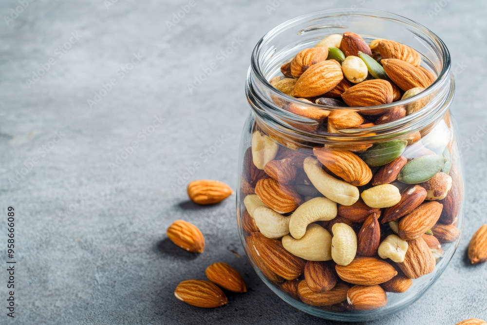Discover a nutritious blend of mixed nuts and seeds stored in a glass jar, perfect for enhancing brain function and promoting healthy snacking anytime. Discover a nutritious blend of mixed nuts and seeds stored in a glass jar, perfect for enhancing brain function and promoting healthy snacking anytime.