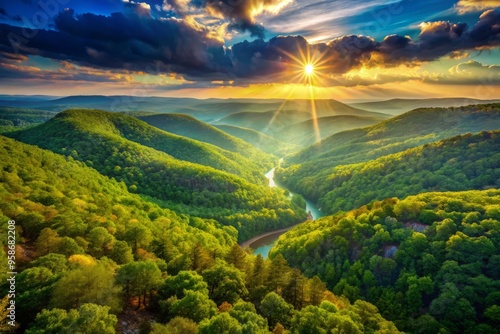 Majestic sun-kissed mountains rise above misty valleys in the Ozark range, Arkansas, with lush green forests and photo