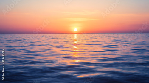 Sunrise over a calm ocean horizon 