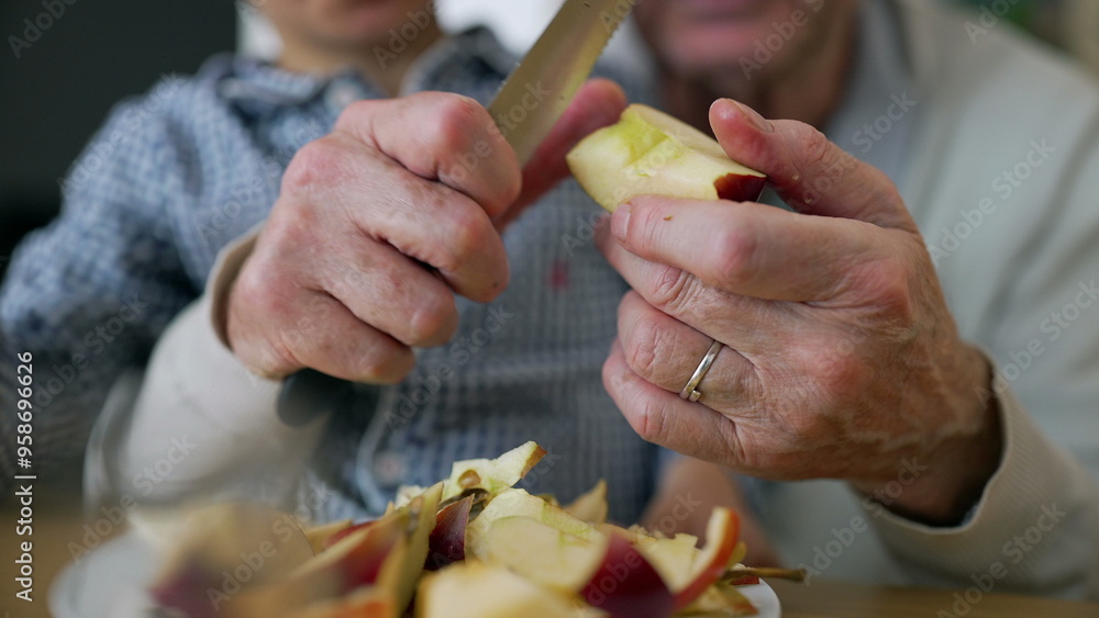 Grandfather and grandson peeling an apple together, hands-on learning, family bonding, close interaction, cutting fruit, educational moment, teaching, caring grandfather, focused child Grandfather and grandson peeling an apple together, hands-on learning, family bonding, close interaction, cutting fruit, educational moment, teaching, caring grandfather, focused child