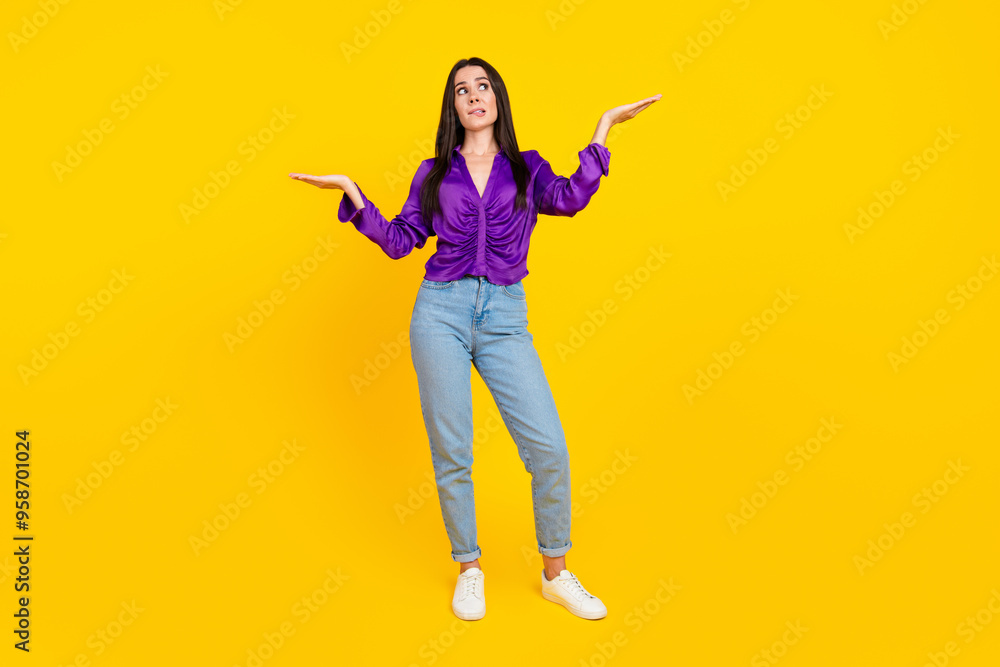 Photo of uncertain lady hold hands measure feel hesitation isolated bright color background Photo of uncertain lady hold hands measure feel hesitation isolated bright color background