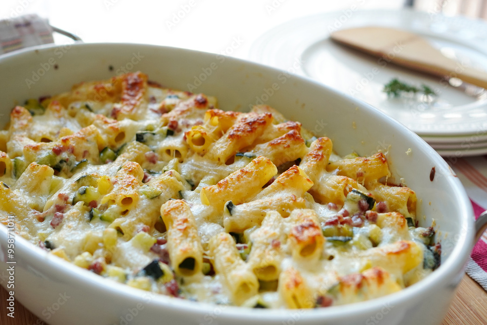Homemade macaroni gratin made with zucchini and ham Homemade macaroni gratin made with zucchini and ham