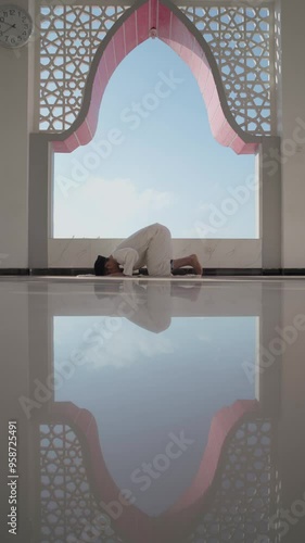 A Muslim is praying in the mosque
